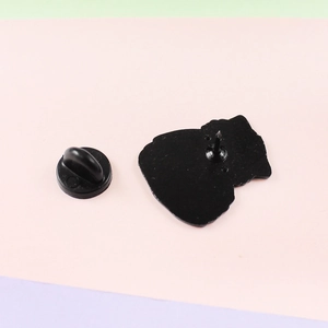Detailed view of the durable black butterfly clutch back and pin for the cat brooch