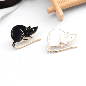 Cartoon enamel mouse brooches in black and white with gold trim on white background