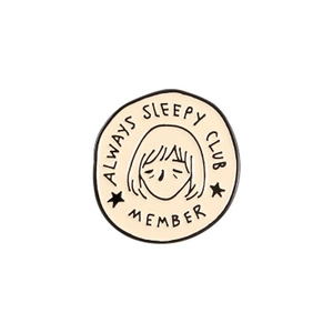 Round enamel badge featuring Always Sleepy Club Member cartoon girl design on white background