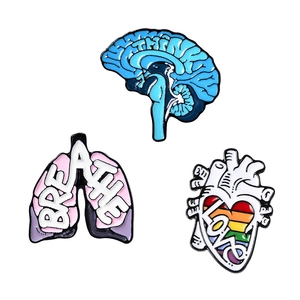 Set of 3 anatomy enamel pins with Just Think brain, Breathe lungs and Love heart designs