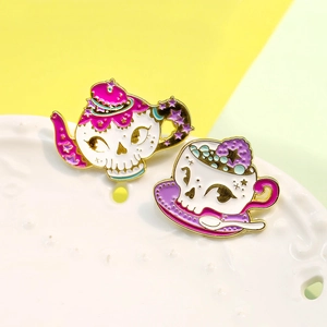 Gothic skull teapot and cup enamel brooch set with purple and pink accents on porcelain