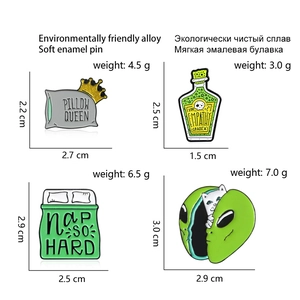 Detailed size and weight specs for various soft enamel pins on a white background