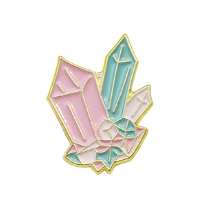 Geometric crystal cluster enamel pin in pastel pink and mint green with gold trim