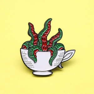 Creative white coffee cup enamel brooch with red octopus tentacles on yellow background