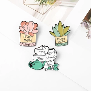 Creative enamel pin set featuring plant mama, plant daddy, and finer things club badge