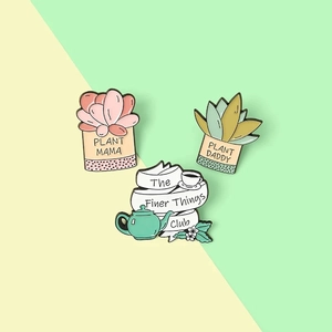 Three enamel pins set with succulents and teapot featuring Plant Mama and Plant Daddy text