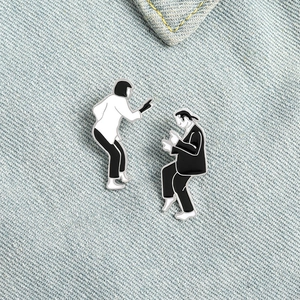 Pulp Fiction dance pose enamel pin set on denim background with Mia and Vincent