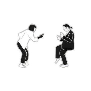 Pulp Fiction inspired enamel dancing couple brooches set in minimalist black and white metal