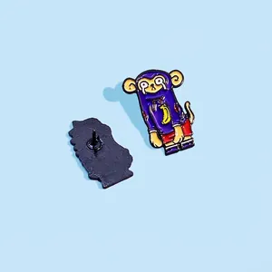 Creative cartoon enamel pin featuring a crying purple monkey with a yellow banana hoodie