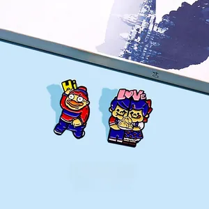Detail of enamel lapel pins with Hi and LOVE cartoon characters on light blue background