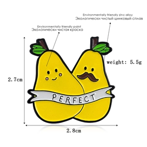Detail view of cartoon pear enamel pins showing product dimensions 2.7cm by 2.8cm