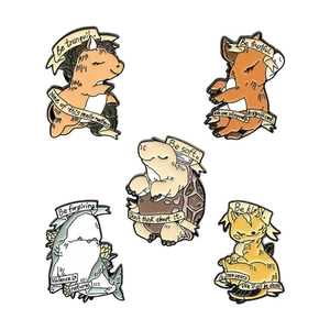 Set of five cartoon animal enamel pins with motivational ribbons on a white background