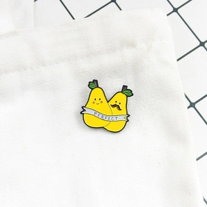 Cartoon pear enamel pins with 'PERFECT' banner for couples pinned on a canvas bag