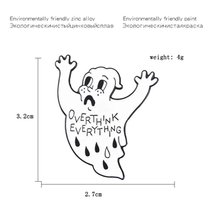 Detailed view of enamel ghost brooch with Overthink Everything text and size specs