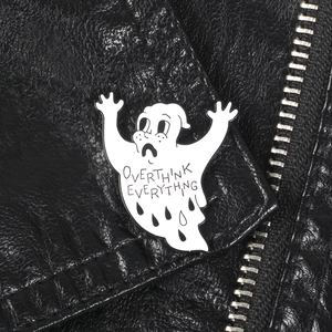 Ghost enamel pin with Overthink Everything text on a black leather jacket lapel