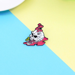 Detailed macro view of a punk skull enamel pin featuring colorful mushroom growth details