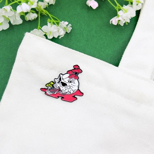 Punk style skull and mushroom enamel pin badge attached to a white canvas bag