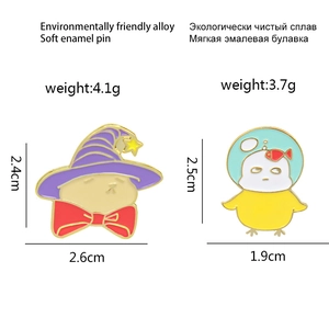 Cute enamel pin set featuring wizard cat and fishbowl chick with dimension details