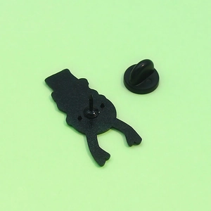Cartoon deer horn doll pin back view with metal needle and black rubber clutch