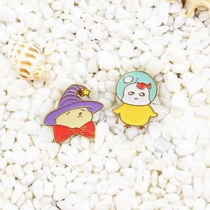 Cute cartoon enamel pins set featuring a wizard cat and a diving chicken on pebbles