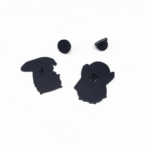 Detail view of the black alloy enamel pin back with secure rubber clutch fasteners