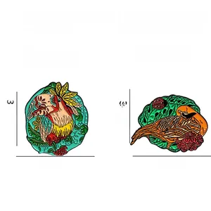 Detail view of colorful enamel toucan and long-tailed bird brooches in alloy