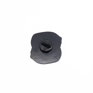 Detail view of the black matte metal back of the brooch with secure rubber clutch back