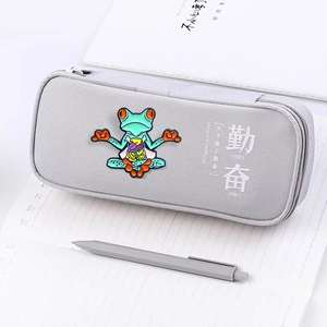 Gray fabric pencil case with cartoon frog patch and Chinese Diligence print on notebook