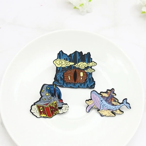 Ensemble de broches créatives en émail avec magicien, œil de grotte et baleine sur un plateau