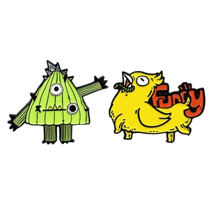Set of 2 funny cartoon enamel pins featuring cactus monster and bird on white background
