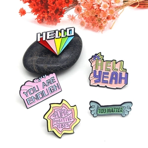 5-piece colorful enamel pin set with motivational quotes like You Matter on white background