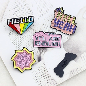 Five-piece set of colorful enamel brooches featuring inspirational quotes and rainbow designs