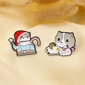 Cute cartoon enamel pins featuring a white cat in a coffee pot and a cat with lemon tea