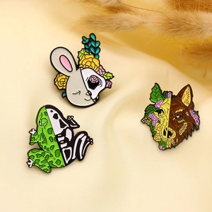 Unique Halloween animal enamel pins featuring half-skull rabbit, frog and wolf artistic designs