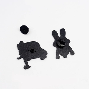 Detail view of the black matte enamel pin backings with rubber and metal clutch fasteners