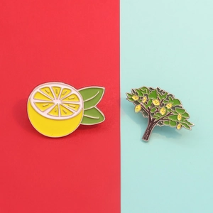 Cartoon lemon fruit and lemon tree enamel pins on red and blue split background