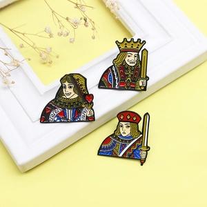 Set of three colorful poker card enamel pins featuring JQK designs on yellow background
