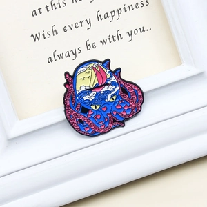 Creative enamel octopus brooch featuring ocean waves and sunset sail in a gift frame