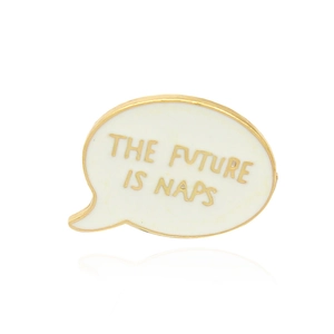 Minimalist white enamel speech bubble brooch featuring The Future Is Naps gold text