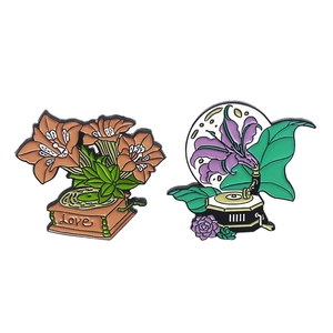 Retro gramophone and lily flower enamel pins in orange and purple zinc alloy