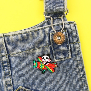 Creative cartoon panda pilot enamel brooch on a red toy plane pinned to denim