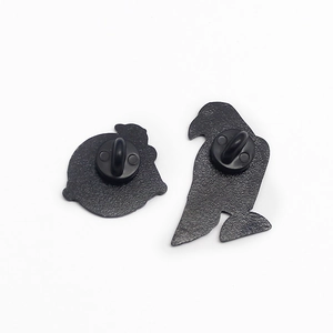 Detailed back view of mechanical bird pins with matte black finish and rubber clutches