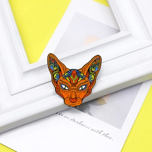 Creative Sphinx cat enamel brooch with exotic colorful geometric patterns on white background