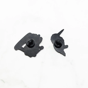 Dual rubber clutches on black enamel crocodile helicopter pins for secure fastening