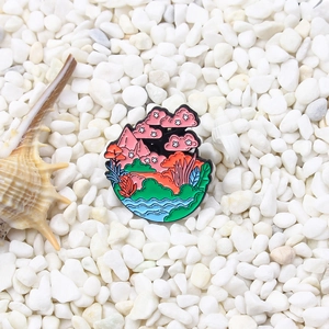 Artistic landscape enamel brooch featuring pink cherry blossoms and scenic nature views