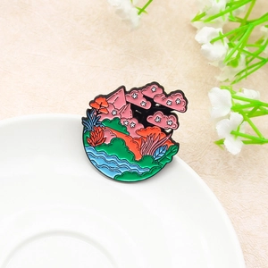 Artistic landscape enamel pin featuring pink mountains and a blue stream scenery