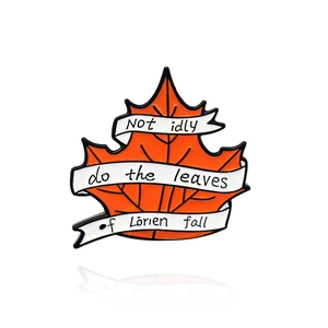 Orange maple leaf enamel pin with white ribbon and Loerien quote on white background