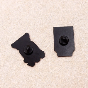 Black enamel pins featuring creative window cat designs with secure black rubber clutches