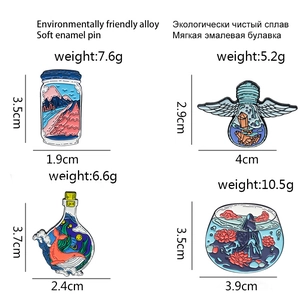 Creative enamel pins set featuring angel bulb, whale bottle, and floral fishbowl designs