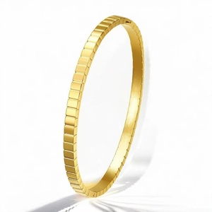 Elegant gold stainless steel bangle with geometric square grid pattern design